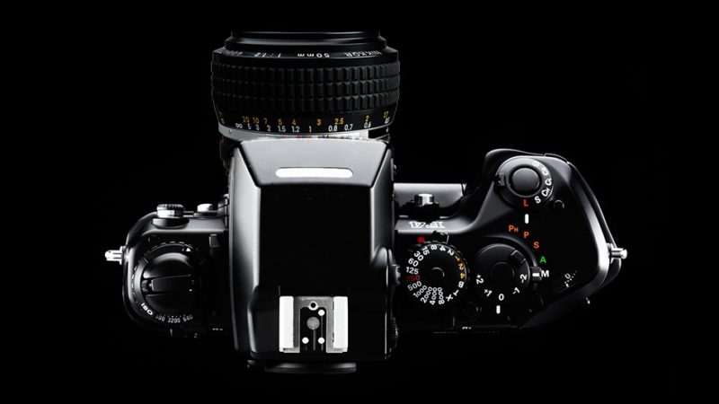A Nikon film camera using the 50mm f/1.2 AI-s lens