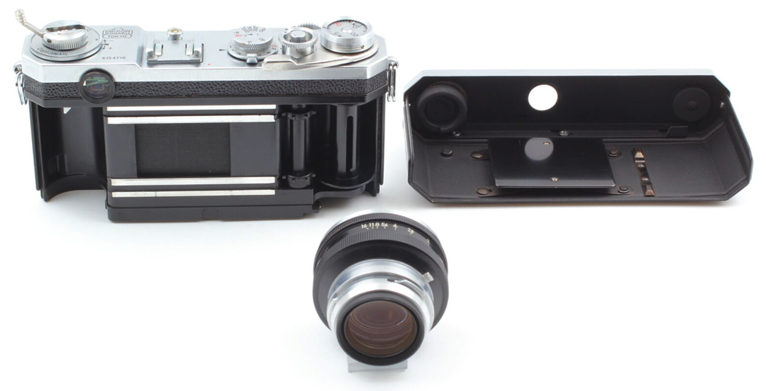 Mid century film loading a Nikon Rangefinder.